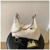 Bolso de hombro de moda con bordado acolchado nuevo modelo 2026 bolso de hombro simple y elegante diseño de nicho bolso de mano con cadena