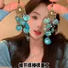 ¡Ah, me encantan los pendientes azules del año! ¡Cada estilo tiene una atmósfera navideña única!