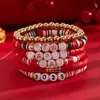 Pulsera de Pulsera Elástica de Diseño de Moda con Cuentas de Arcilla Roja para Año Nuevo 2025 Transfronteriza Europea y Americana
