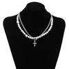 Pequeño collar Xiangfeng de doble capa con perlas reflectantes, cadena de acero de titanio y clavícula, collar con cruz de viento neutro superpuesta.