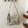 Bolso de mano nuevo para mujer 2026, bolso de hombro, bolso cruzado, disponible en varios colores, moderno y versátil, con accesorios decorativos