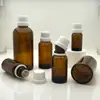 Em estoque frascos de óleo essencial âmbar 5-100ml conservação de óleo essencial subembalagem cosmética frascos de vidro cor âmbar marrom que evitam a luz
