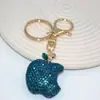Venta al por mayor del fabricante Llavero de Manzana de Arcilla Blanda con Diamantes, Lindo Colgante Personalizado para Bolso, Llavero de Coche, Accesorios Coloridos