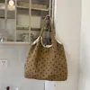 Bolso de lona casual de gran capacidad con lunares para mujer, nuevo estilo 2026, bolso de hombro simple y versátil, adecuado para el trabajo y los desplazamientos