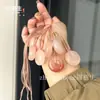 Colgante de Paz Flor de Durazno de Seda Dorada de Xinjiang, Adorno Colgante de Paz Ágata Ojo de Gato Verde de Tianshan, Fuente de Suministro para Transmisiones en Vivo