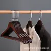 Perchero de madera maciza antideslizante sin costuras, tendedero de madera para tiendas de ropa y hoteles, perchero para pantalones con pinzas, perchero para ropa de adulto al por mayor