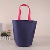 Bolsa de cubo no tejida bolsa de fondo redondo bolsa tote para ropa nueva moda bolsa tote para ropa de niños se puede personalizar LOGOTIPO