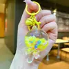 Chaveiro Pirulito Areia Movediça Luminoso Infundido com Óleo Pingente Fofo para Mochila Chaveiro Presente de Parque de Diversões Brinquedo Infantil