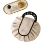 Bolsa de maquillaje perezosa de nuevo estilo para mujer, bolsa de almacenamiento de viaje de gran capacidad, bolso plano con cordón para viajes al aire libre y neceser
