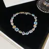 [Cadena de Diamantes Arcoíris] Pulsera de extracción de zircón trenzado en cruz, una pulsera lujosa y de alta gama, una pieza de joyería delicada y de moda