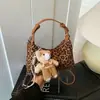 Bolso con Forma de Concha de Color Sólido Retro de Moda para Mujer 2026 Nuevo Bolso de Mano de Gama Alta para el Trabajo Bolso Cruzado Versátil