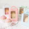 Una caja para cupcakes muffins con rejilla, caja para pastel plegable portátil, vaso de papel, caja punto occidental, caja para huevo, caja de embalaje, venta al por mayor