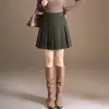 Saia plissada xadrez da moda para mulheres, novo estilo outono e inverno de 2026, cintura elástica, saia curta em linha A que afina, versátil e casual