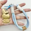 Chaveiro de Ouro Puro 999 Melodia Fofo Criativo Desenho Animado Cordão Corrente para Celular Bolsa Pingente Presente