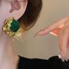 Pendientes elegantes vintage de cristal verde exagerado de estilo antiguo medio nicho, pendientes de lujo ligeros de estilo europeo y americano de estilo francés.