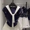 Terno Estilo Preppy para Meninas 2025 Novo Estilo Meninas Falso Conjunto de Duas Peças Estilo Manga Curta Calças Culotes Flor de Botão