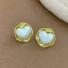 Brincos de Tarraxa Coração Cruzado Europeus e Americanos Brincos com Textura de Pérola Fashion Leve Luxo Alto Padrão Simples e Generoso Joias para Orelha Atacado