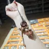 Peonza de madera de azufaifo, cadena para teléfono móvil, colgante de bolsa para peonza, llavero, correa colgante anti-pérdida de gran venta
