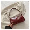 Bolso de charol brillante para debajo del brazo para mujer, nuevo modelo 2026, bolso de un solo hombro cruzado, simple y elegante, bolso de mano versátil de nicho para mujer