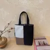 Bolsa para Garrafa de Água com Bloqueio de Cor Simples Bolsa de Mão Feminina 2026 Outono Nova Bolsa de Lona Nicho Ombro Único Bolsa Tote para o Dia a Dia
