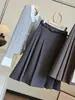 Falda midi plisada de lana a cuadros estilo traje de academia para mujer, otoño e invierno, nueva versión coreana, cintura alta, adelgazante, longitud media