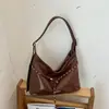 Bolso de hombro minimalista estilo coreano transfronterizo para mujer, nuevo diseño de nicho vintage 2026, bolsa de mano de gran capacidad para el día a día
