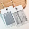Etiqueta de ropa ropa personalizada listado de ropa para mujer marca de ropa tarjeta translúcida LOGO diseño gratuito tarjeta colgante