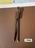 Llavero de cordón de cuero PU transfronterizo, colgante versátil para bolso, accesorios de decoración para botellas de agua y muñecas DIY, llaveros al por mayor