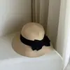 Sombrero de paja de rafia importado de ala ancha con lazo grande para el verano para mujer, plegable, protector solar, sombrilla de playa, hace que la cara se vea más pequeña