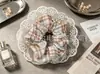 Scrunchie atmosférico para mulheres, elástico de cabelo elegante em renda floral. Acessórios em estoque para atacado
