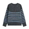 Venta al por mayor transfronteriza 2026 Moda europea y americana casual suelta semiabierta cuello redondo manga larga suéter de punto a rayas para mujer E75545