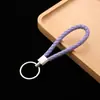 Llavero de cuerda de cuero colgante para coche accesorios cuerda de llave de cuerda de cuero tejido pu para empujar pequeño regalo fabricantes al por mayor