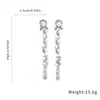 Pendientes de botón con borla y perla incrustados con diamantes de aguja de plata transfronterizos europeos y americanos, pendientes de sentido de lujo ligero de alta gama, accesorios de pendientes versátiles y exquisitos de moda para mujeres