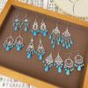 Pendientes colgantes de piedra de pino de estilo nacional retro bohemio europeo y americano transfronterizos, pendientes con borlas huecas, venta directa de fábrica