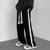 Pantalones deportivos holgados de pierna ancha para hombre para primavera y otoño con rayas laterales de cuerda tejida, pantalones de marca de moda