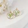 Aretes exquisitos de flor real de venta caliente transfronteriza resina gota pegamento joyería de flor seca aretes nomeolvides joyería artesanal al por mayor