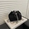 Bolso de mano tipo cubo de nuevo diseño para mujer, otoño temprano 2026, bolso de cadena de moda, bolso de hombro, bolso cruzado, bolsos de mujer al por mayor