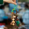 Cascabel Campana de Mano Carrillón Colgante de Bolsa Hecho a Mano Rayo de Sonido Cascabel Colgante Fruta Negra Indonesia Cáscara Fábrica Venta al por Mayor