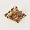 Hebilla decorativa de metal con pedrería calada de lujo estilo botón para el bajo de un abrigo de traje, accesorio de alta gama para ropa de mujer