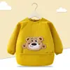 Babero de terciopelo de cristal para bebé, impermeable, antidesgaste, con bolsillo de arroz, para otoño e invierno, delantal para madre y bebé.