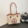Bolsa de Lona Grande Capacidade para Deslocamento Transfronteiriço 2026 Novo Estilo Bolsa Feminina Casual Estilosa Versátil Bolsa de Ombro para Estudantes Universitários