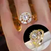 Anillo de Girasol de Zirconia Sintética Exquisita de Alta Gama y Lujo para Mujer con Diseño Único y Anillo de Flor en Forma de Molino de Viento Giratorio