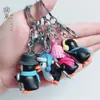 Directo de fábrica llavero creativo de PVC pingüino lindo esquiando colgante para bolsa muñeco de llavero de dibujos animados colgante