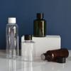 Botella de plástico transparente de hombros redondos de 50 ml 100 ml con superficie lisa y tapa de rosca, botella de rocío puro subenvasada para cosméticos, botella de tónico