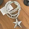 Colar com Pingente de Pérola e Estrela-do-Mar Multicamadas Estilo Menina Doce e Cool Picante para Mulheres, Corrente de Clavícula com Design de Nicho, Corrente de Pescoço Levemente Luxuosa e Elegante