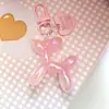 Color caramelo bola láser perro estilo ins llavero colgante amor bolso de mujer colgante para teléfono móvil accesorios DIY