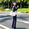 Conjunto casual de otoño para niñas para yoga, nuevo estilo 2026, sudadera con capucha de moda y pantalones acampanados, conjunto de dos piezas para estudiantes de secundaria