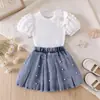 26 Atuendo de verano para niñas de comercio exterior transfronterizo: nueva camiseta floral de manga abullonada + falda de mezclilla con perlas, elegante y chic, venta al por mayor