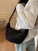 Bolsa Casual Versátil Leve de Grande Capacidade Transfronteiriça em Formato de Chifre para Mulheres Novo Modelo 2026 Bolsa Meia-Lua Bolsa de Ombro Transversal de Nicho
