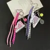 Zapatos Estilo Deportivo Llavero de Tenis Nicho Gama Alta Serie Miu Colgante de Cuerda Trenzada para Bolso Venta al por Mayor